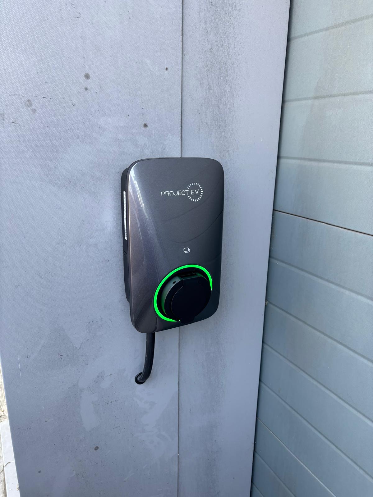 Project EV charger installed on an exterior wall