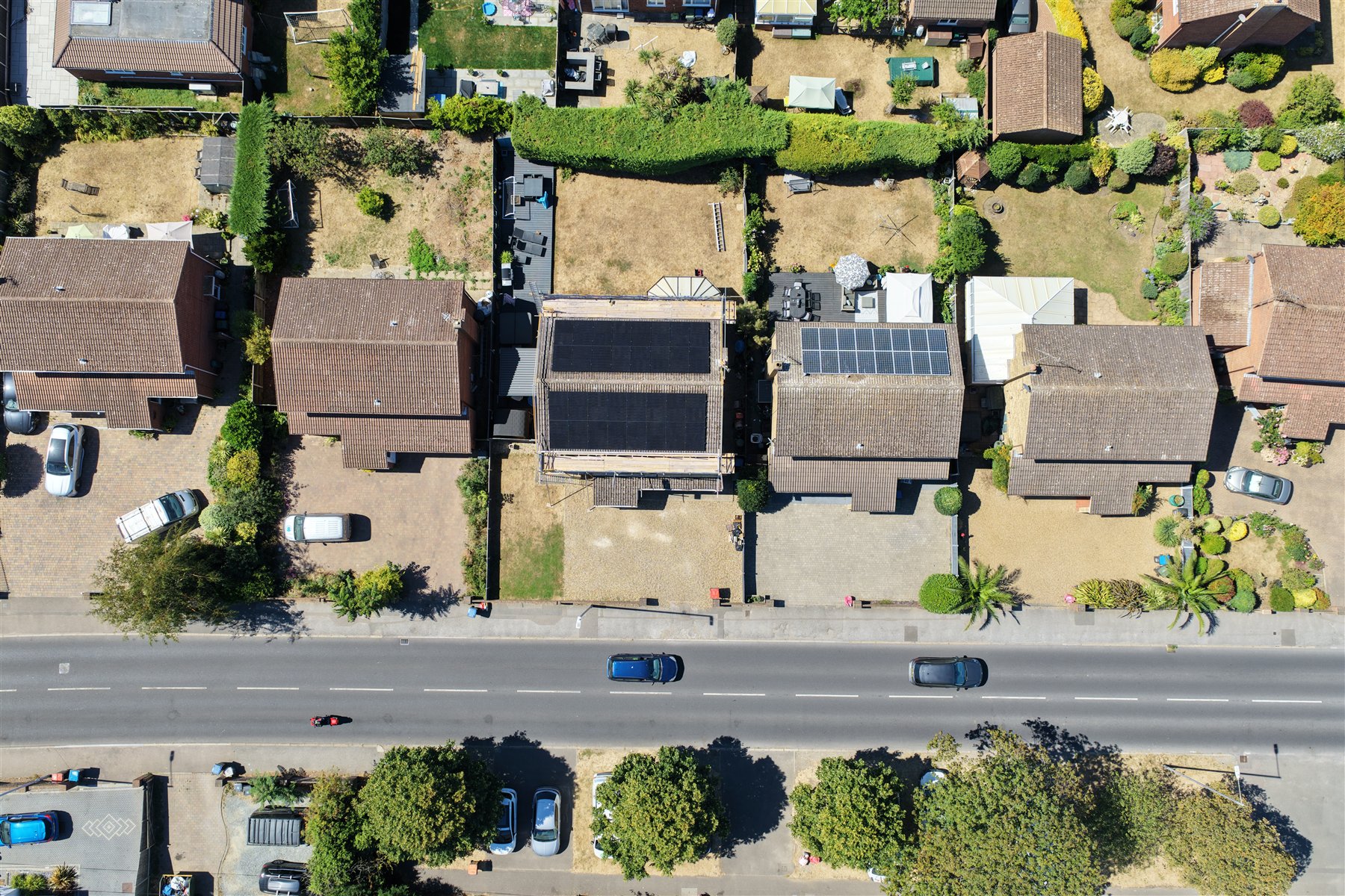 Drone view of a residential solar installation across two roof elevations in Kent