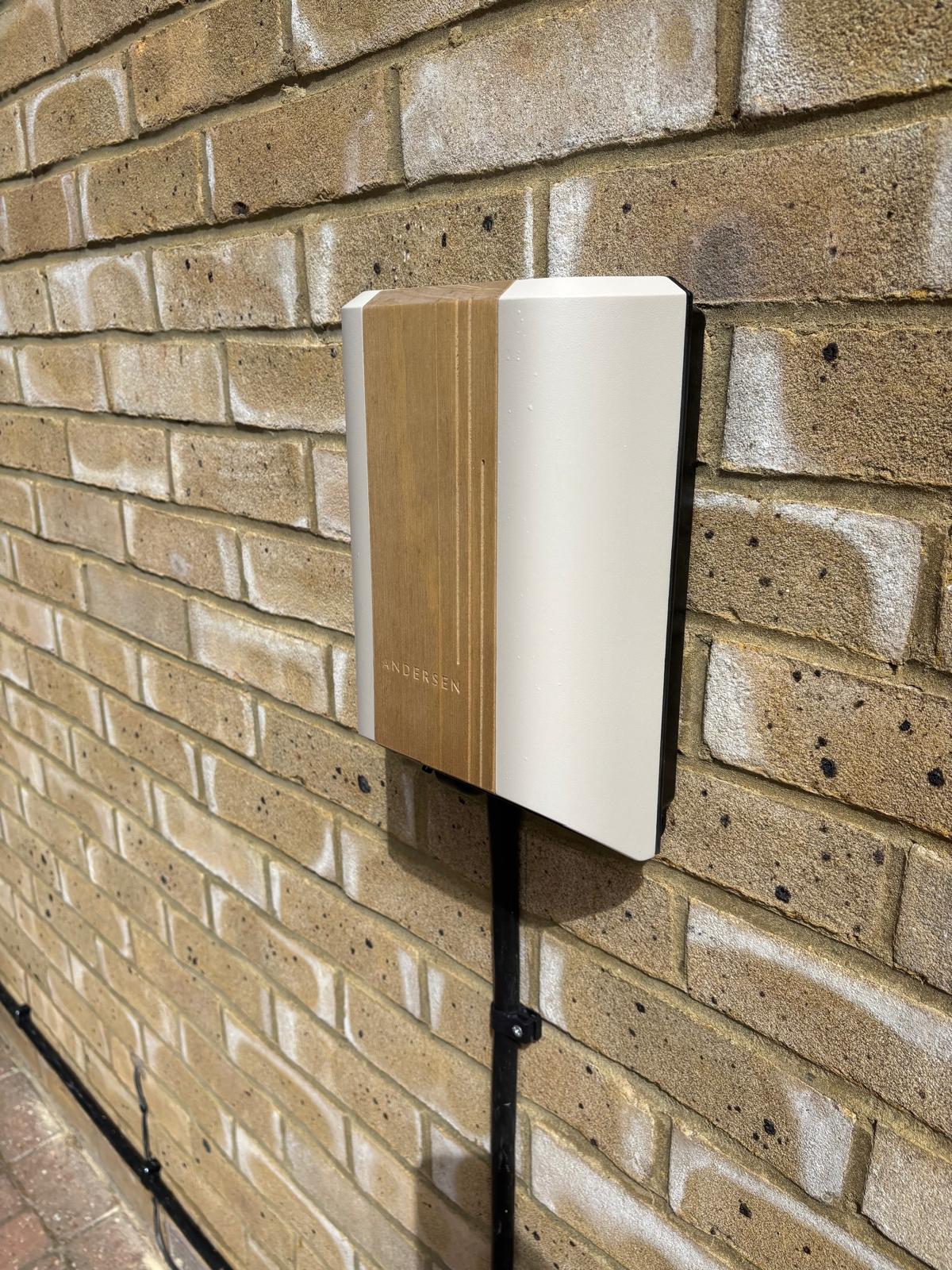 Andersen electric vehicle charger with a premium wood-effect finish